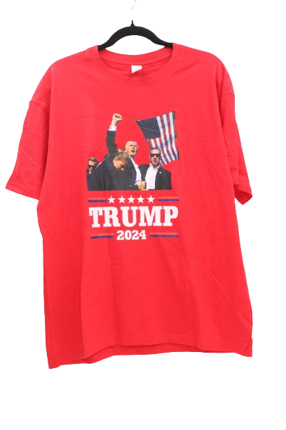 Red t shirt displaying Trumps fist pump in front of the American flag after the assassination attempt